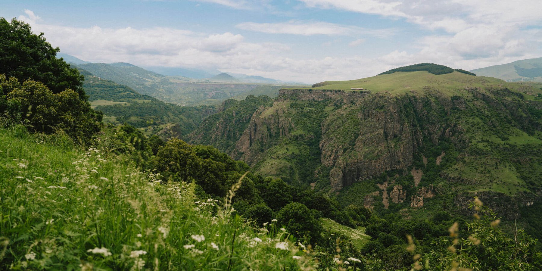 Looking-out-over-a-gorge-and-mountains-on-a-Slow-Cyclist-journey-in-Armenia