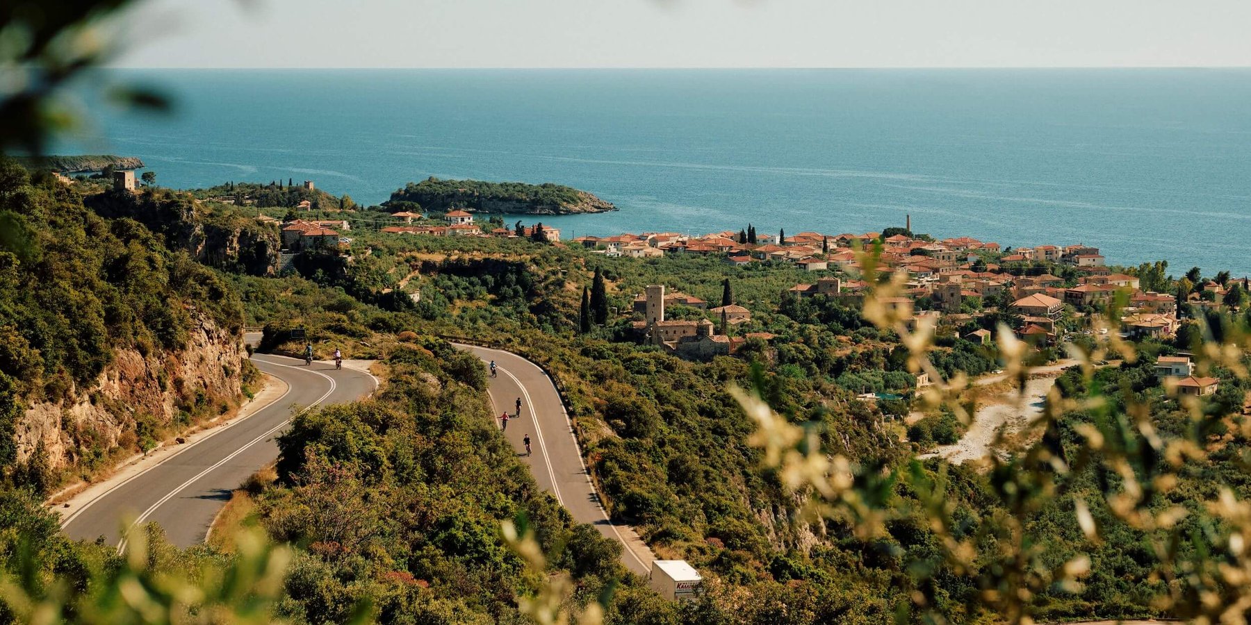 Slow-Cyclists-on-a-winding-road-in-the-Mani-Greece