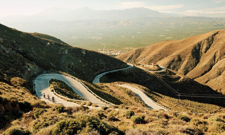 Slow-Cyclists-on-winding-roads-in-Crete-Greece