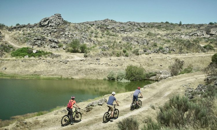 Slow-Cyclists-riding-alongside-the-Coa-River-Portugal